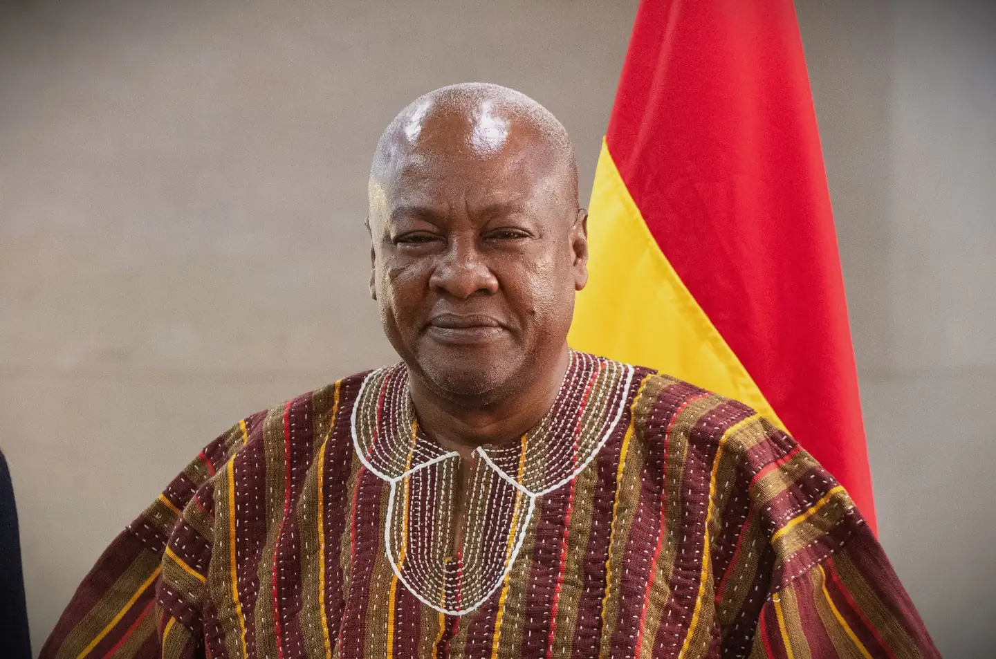 President Mahama, photographed beside the flag of Ghana.
